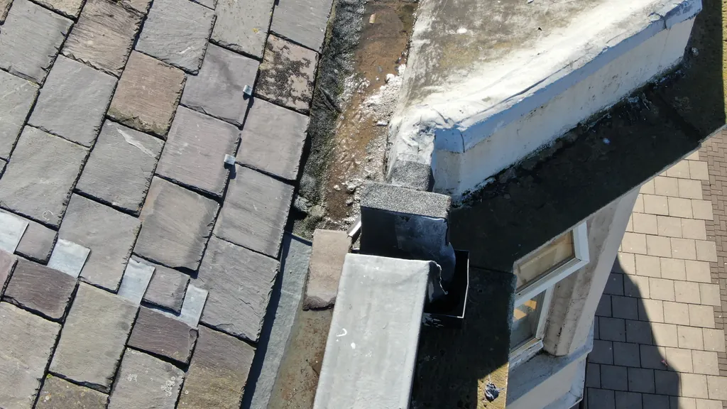 Drone inspection in Blackpool: worn paving slabs beside a parapet
