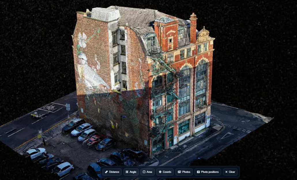Interactive 3D model of a multi-storey red-brick commercial building