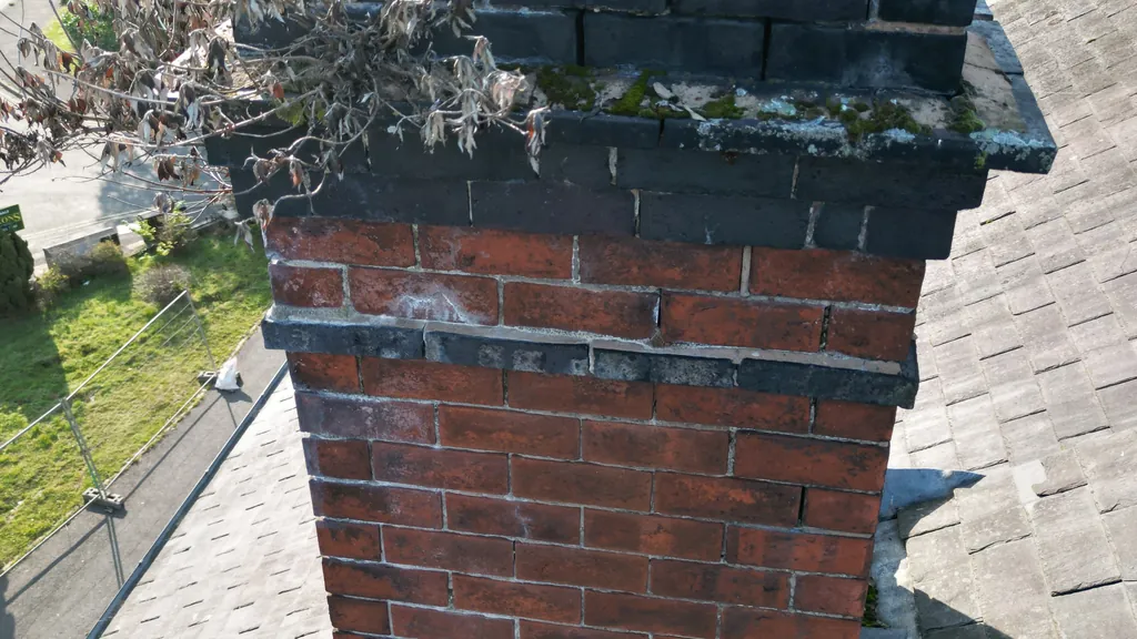 Drone chimney survey in Hull: mossy coping on a brick chimney stack