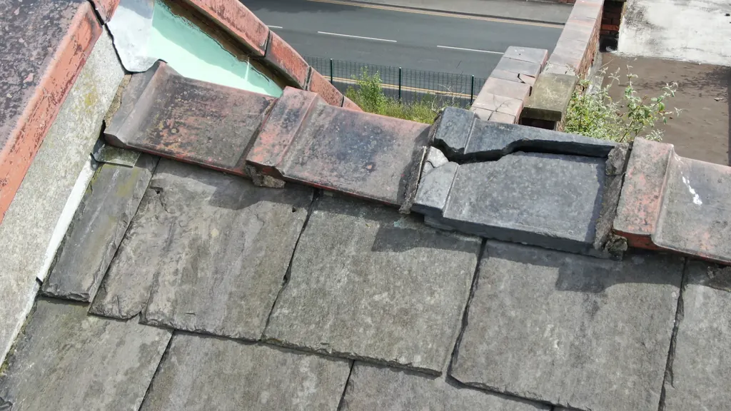 Drone roof survey in Rugby: broken ridge tile at a parapet wall